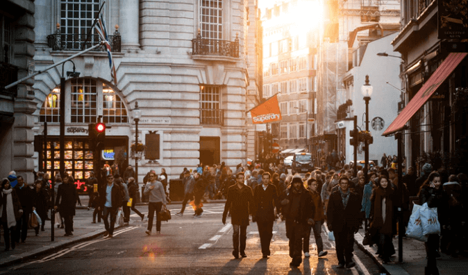 People walking on a street of London.