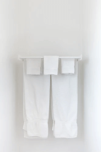 Hanged Towels Behind the Toilet.