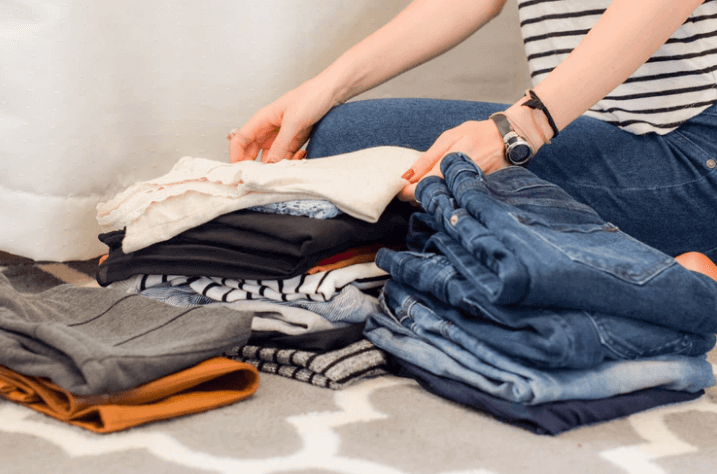 Woman folding clothes.