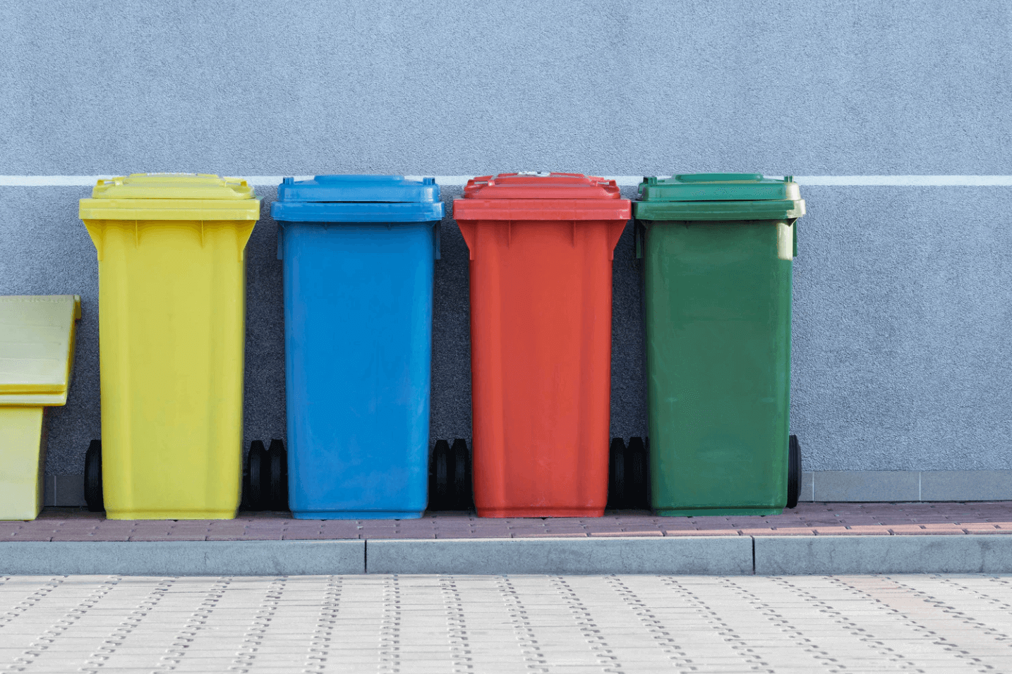 Recycling bins in different colors.