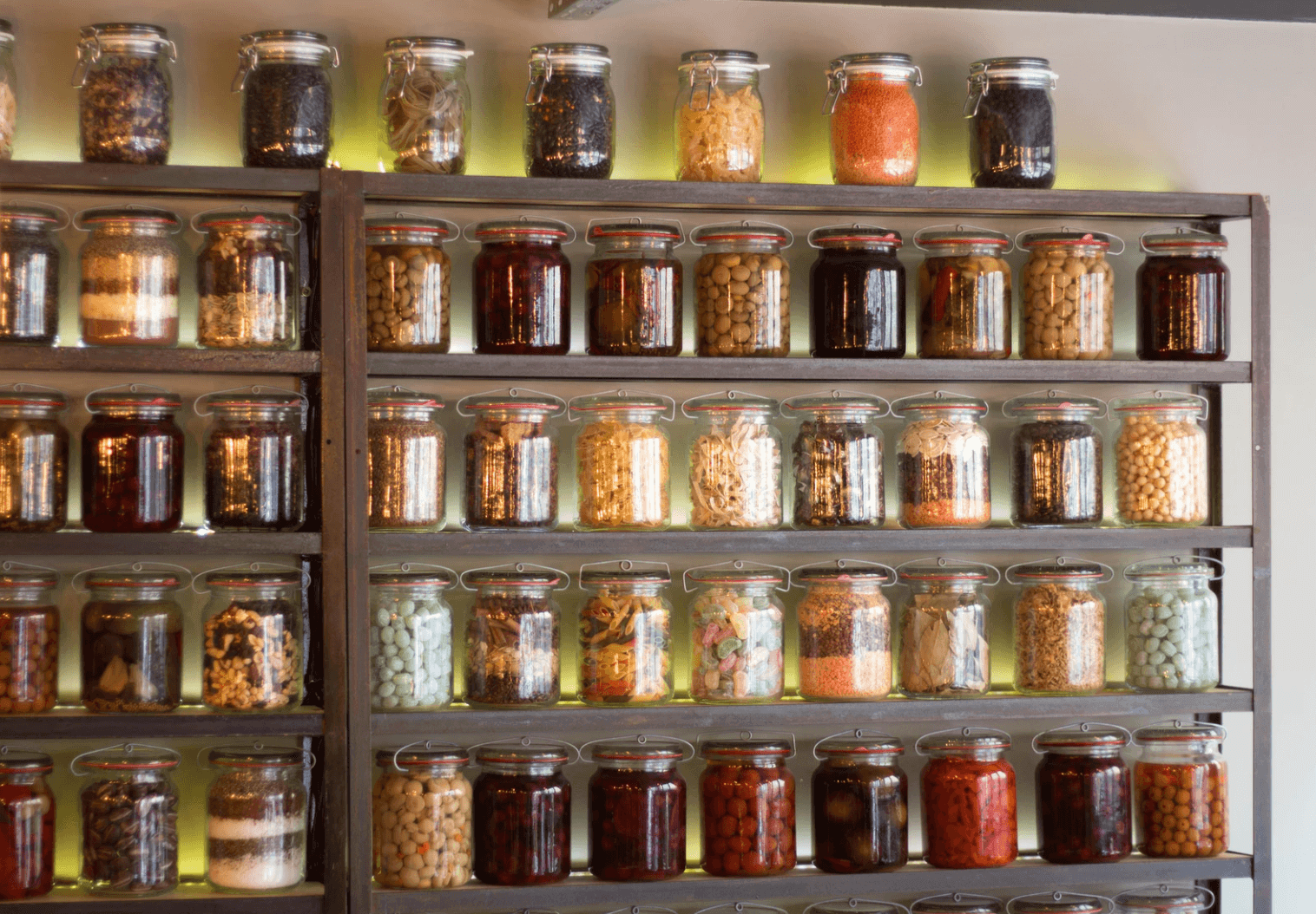 Jars of different colors stored.